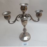 A two branch silver candelabrum,
