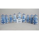 A set of nine French blue and white ceramic Delft storage jars and covers,