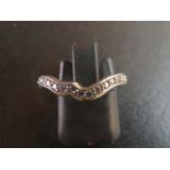 A platinum and diamond 1/2 eternity ring (size G) est: £200-£300