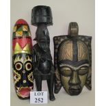 African Tribal Art - comprising a female figure and two ceremonial masks,