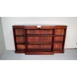 A fine rosewood 19th century break front open bookcase with decorative flower mounts and adjustable