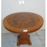 A pretty Art Deco walnut side table with a quarter veneer figured walnut top over a pedestal base
