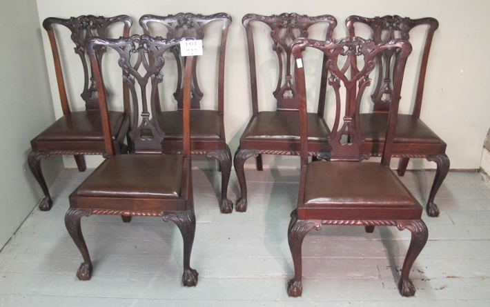 A set of six mahogany framed Chippendale design dining chairs with brown leather upholstered seat