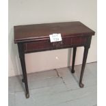 A Georgian mahogany tea table with a centre drawer and terminating on pad feet est: £350-£450