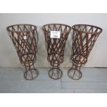 Three rustic iron basket jardiniere's with weave design est: £300-£500