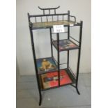 A 19th century black lacquered bamboo shelf with applied Japanese figural paper est: £25-£45