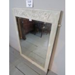 A decorative grey painted and carved wall mirror with bevelled glass est: £25-£45