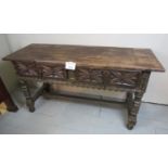 An 18th century Spanish oak dresser with two deep carved drawers and centre stretcher est: