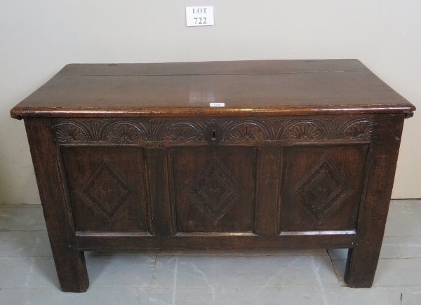 A 19th century oak coffer of small proportions with carved frieze over iron lock to interior est: