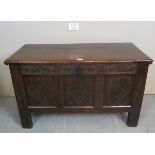A 19th century oak coffer of small proportions with carved frieze over iron lock to interior est: