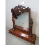 A large Victorian carved mahogany table top/dressing table mirror with carved and reeded supports