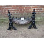 A 19th century wrought iron fire basket and dogs est: £30-£50