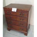A 19th century mahogany bachelor's chest of small proportions with pull out brushing slide over