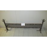 A wrought iron fire fender est: £20-£40