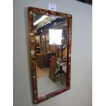 A pretty red lacquered wall mirror with flower and bird design to frame est: £40-£60