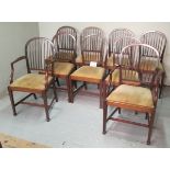 A set of nine 19th century dining chairs upholstered in cream material with reed back spindles est:
