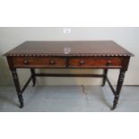 A 19th century mahogany hall table with carved moulding over two drawers and reeded legs,