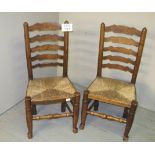 A pair of 19th century ladder back rush seated chairs with turned supports est: £30-£50