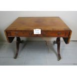 A Regency mahogany sofa table with two drawers over reeded legs and brass castors est: £800-£1,