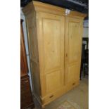 A 19th pine double wardrobe with double panelled doors,