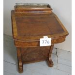 A Victorian walnut inlaid Davenport desk with a tan leather slope top and four drawers to one side