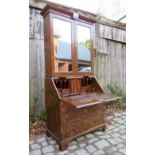 A fine George I walnut bureau bookcase w