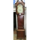 A Georgian mahogany cased long case clock with swan neck pediment over a painted moon face dial