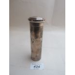 A silver tubular container with gilded i