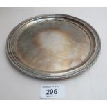 A silver circular tray (8" diameter appr