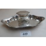 A panel cut glass inkwell with silver mo