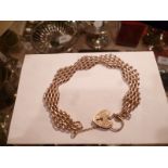 A 9ct gold gate link bracelet with padlo