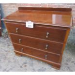 A 20th century mahogany chest of three l