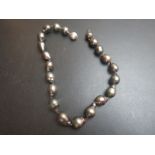 A pearl necklace with an 18ct gold and d