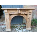 A rustic solid pine chunky fire surround