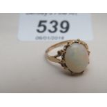 A 9ct gold opal ring (size M) est: £50