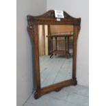 A Victorian design carved wall mirror es