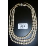 A three strand pearl necklace set with d