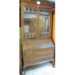 A mahogany bureau bookcase with double g