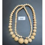 A 19th century ivory bead necklace, 36"