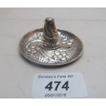 A Mexican silver ring holder in the shap