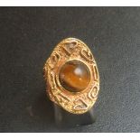 Possibly 18ct gold ring inset with tiger