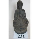 A Chinese bronze statue of a seated Budd