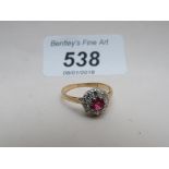 A gold ruby and diamond set ring (size M) est: £220-£250