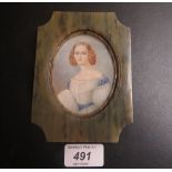 A framed miniature of a lady wearing a w
