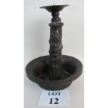 A antique Chinese copper candle holder,