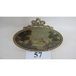 Italian School (early 20th century) - An indistinctly signed oval miniature depicting rural