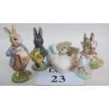 Four Beswick Beatrix Potter figures, 'Peter with Postbag', 'Little Black Rabbit', 'Peter in Bed',