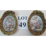 A pair of hand-painted oval miniatures depicting still life studies,