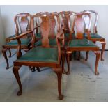 A set of eight Queen Anne design walnut dining chairs, upholstered in green leatherette,