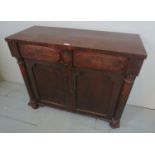 A Victorian mahogany chiffonier sideboard with two drawers to top over cupboard doors flanked